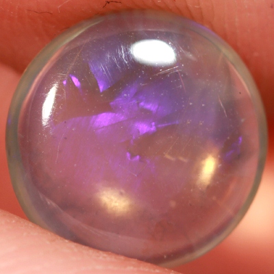 SOLID CRYSTAL OPAL Transparent with a pretty deep purple jumping